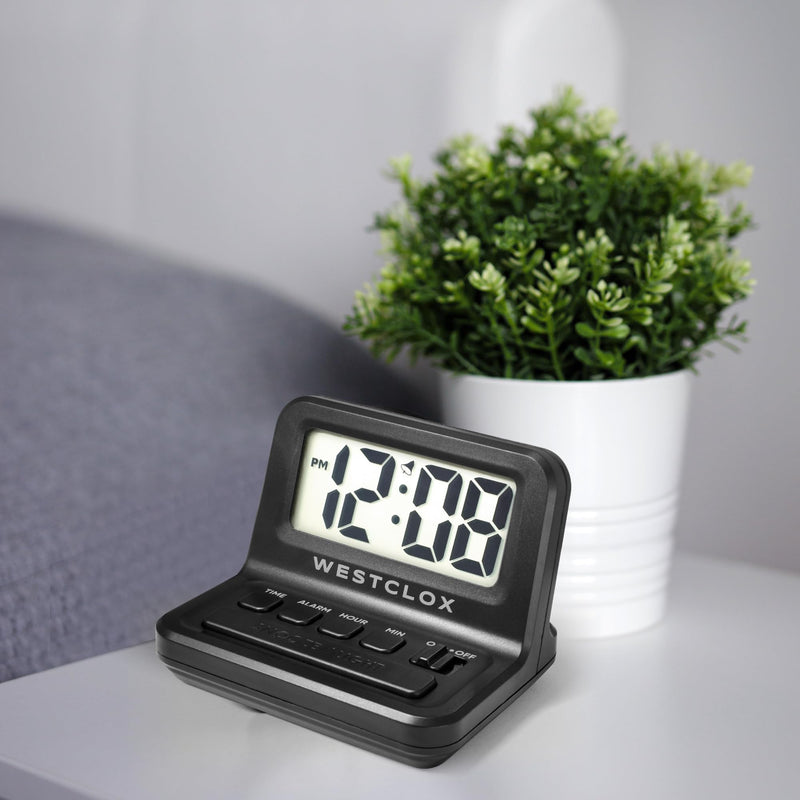 Westclox LCD Digital Bedside Alarm Clock with White Backlit Display and Snooze Function, Battery Operated, (Black, 3-Inch) Black