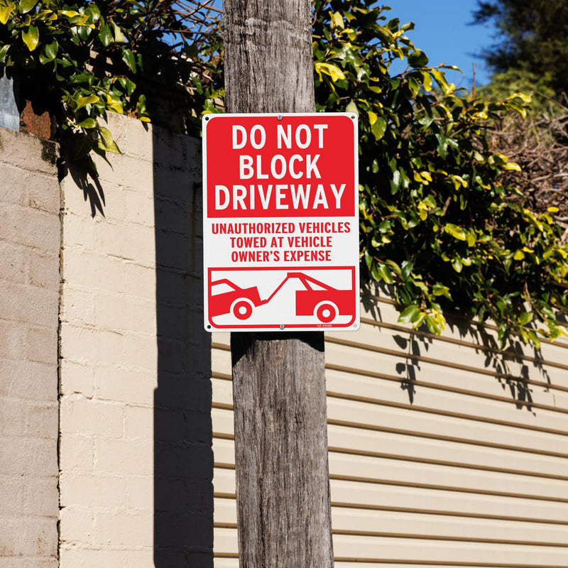 T&R Large Do Not Block Driveway Signs, Unauthorized Vehicles Towed At Vehicle Owner's Expense - 14 x 10 Inches Rust Free .040 Aluminum Reflective - UV Protected, Waterproof and Fade Resistant - 6 Pre-drilled Holes Do Not Block Driveway 14" x 10" - 1 Pack
